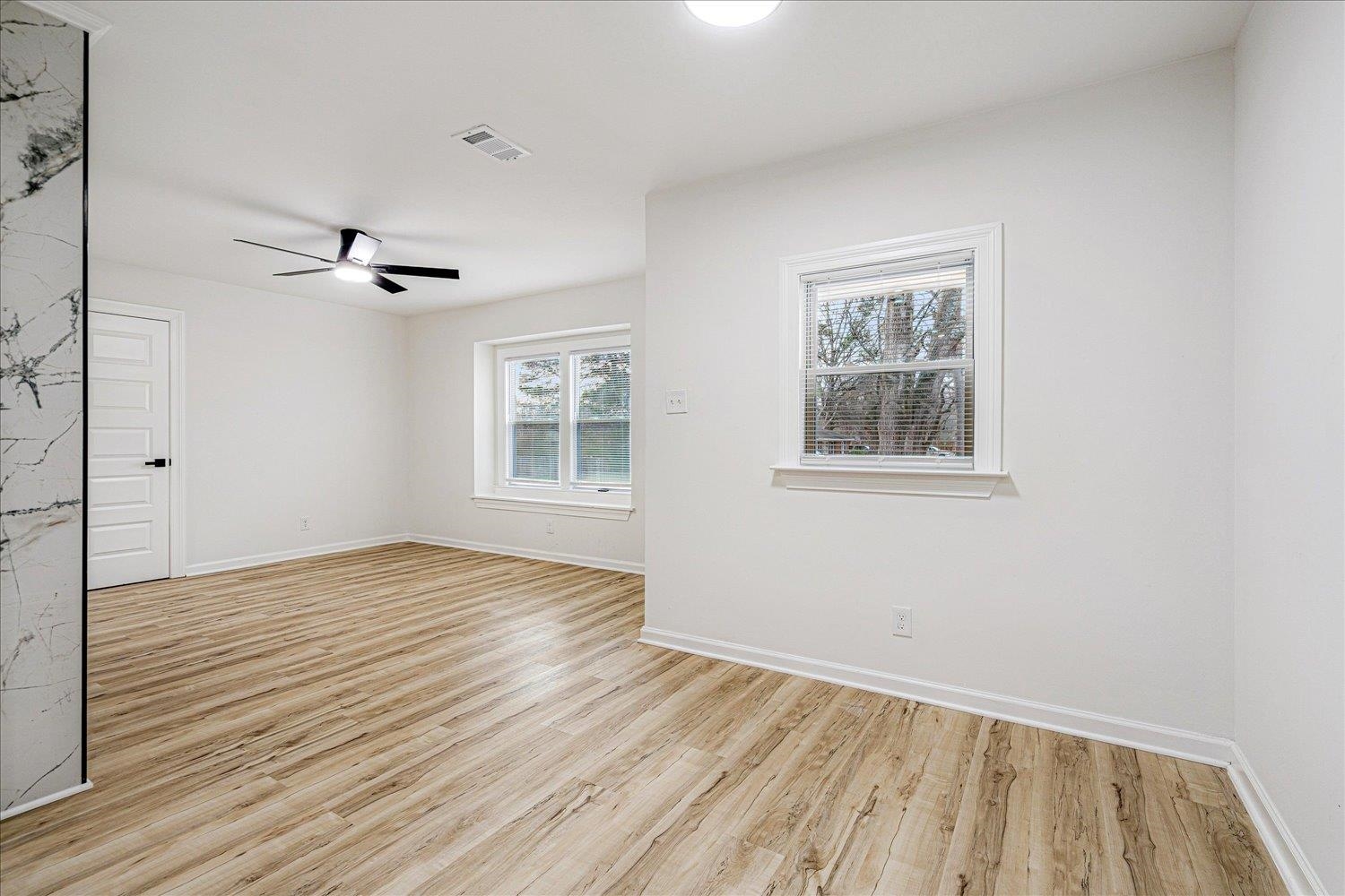 4016 Leech Road Memphis, TN 38109 - Photo 11 of 21 Spare room with light wood-style floors and a ceiling fan