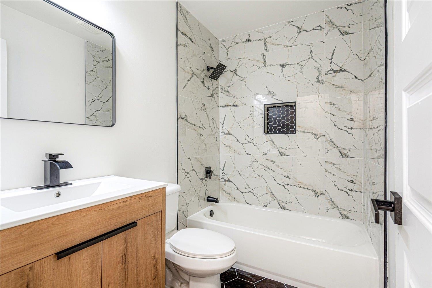 4016 Leech Road Memphis, TN 38109 - Photo 16 of 21 Full bathroom with shower combination and vanity
