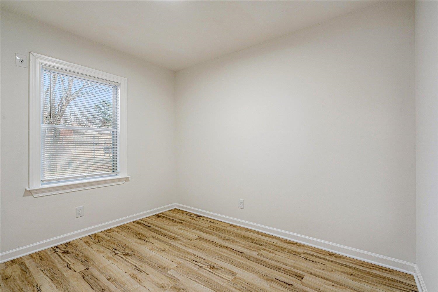 4016 Leech Road Memphis, TN 38109 - Photo 19 of 21 Unfurnished room featuring light wood-style flooring and baseboards