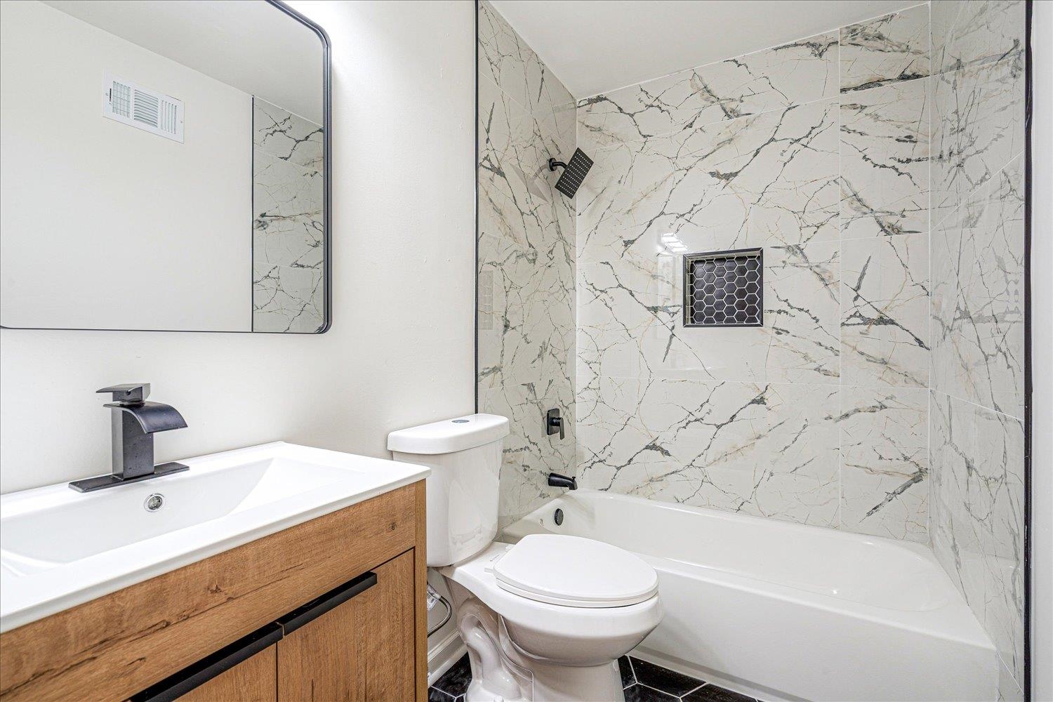 4016 Leech Road Memphis, TN 38109 - Photo 21 of 21 Bathroom featuring vanity and tub / shower combination