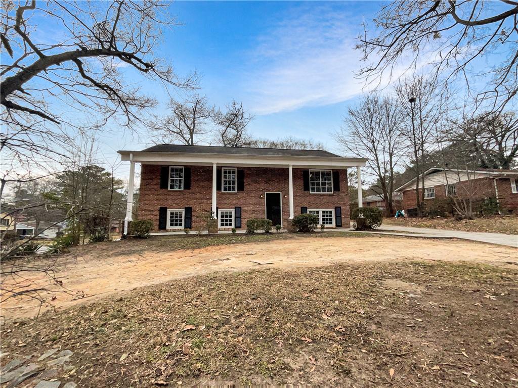 3710 Bakers Ferry Road Southwest Atlanta, GA 30331 - Photo 1 of 1 a front view of a house with a yard