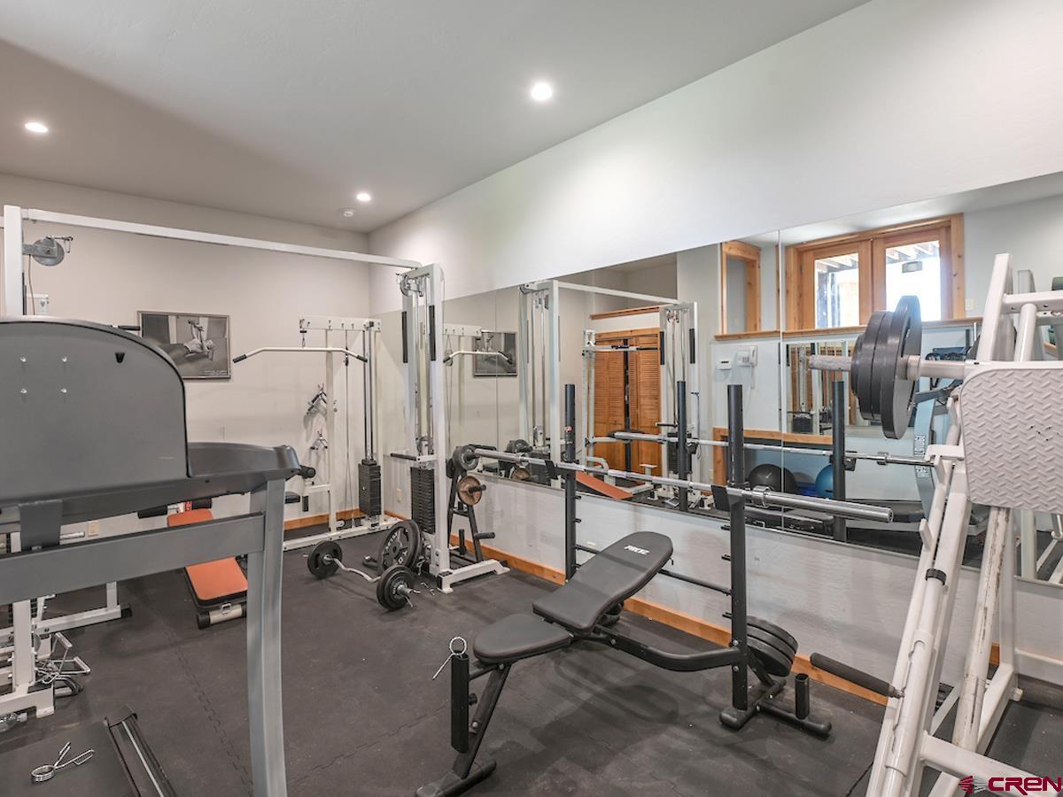 39 Whetstone Road Crested Butte, CO 81225 - Photo 14 of 35 a room with gym equipment and windows