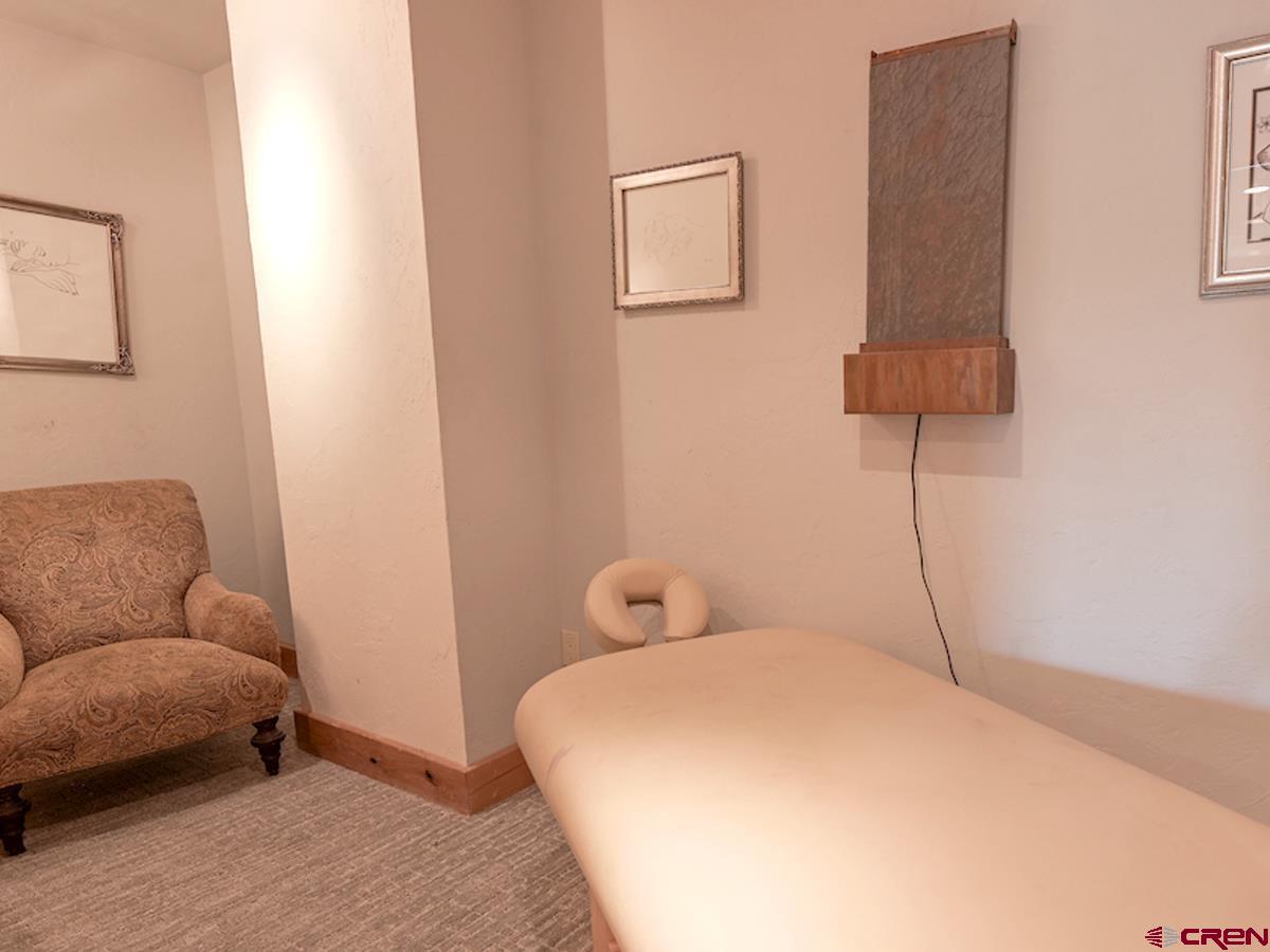 39 Whetstone Road Crested Butte, CO 81225 - Photo 21 of 35 a bedroom with a bed and a couch