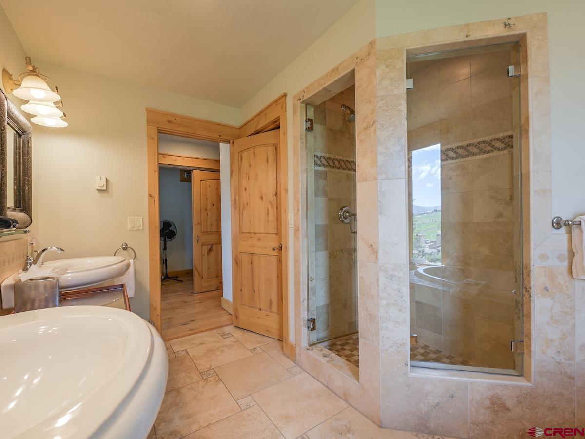 39 Whetstone Road Crested Butte, CO 81225 - Photo 28 of 35 a bathroom with a tub and shower