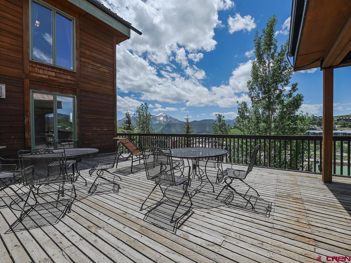 39 Whetstone Road Crested Butte, CO 81225 - Photo 31 of 35 a view of chairs and table on the wooden deck