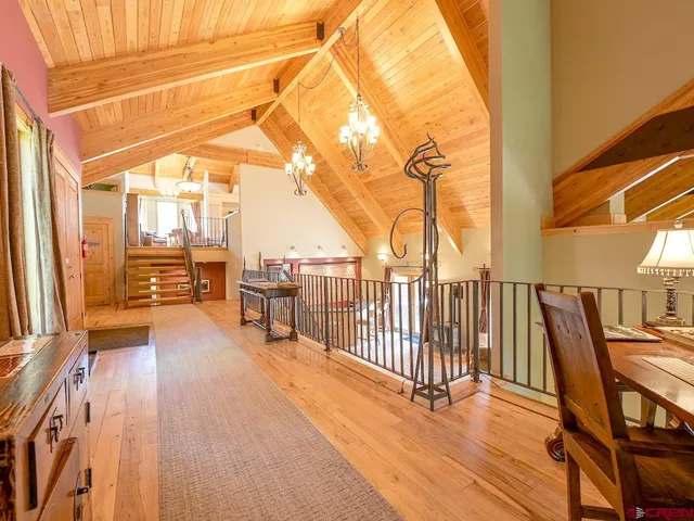 a kitchen with stainless steel appliances granite countertop a stove a sink and dishwasher cabinets with wooden floor