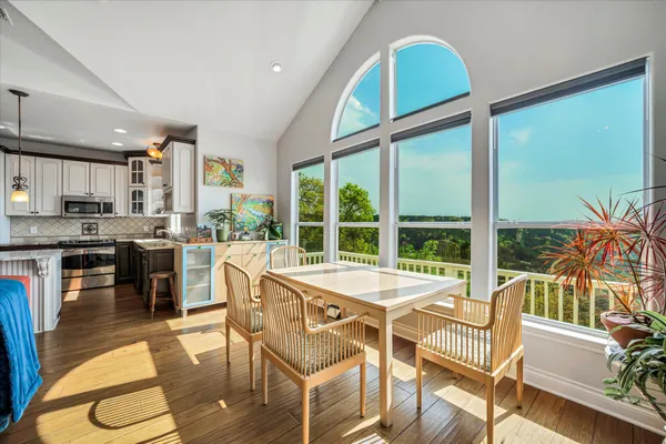 a view of a dining room with furniture window and outside view