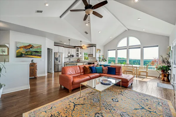 a living room with furniture and a large window