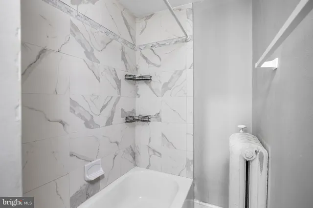 a bathroom with a toilet and shower