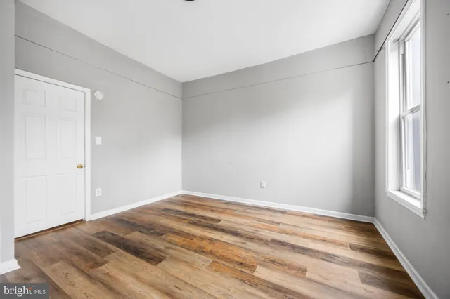 a view of a room with stairs and a ceiling fan