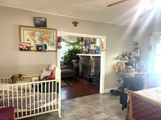 a bedroom with furniture and a window