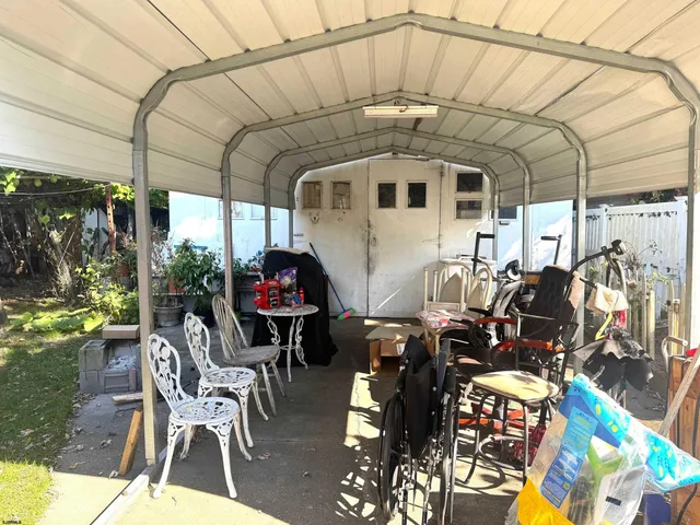 a front view of a house with outdoor seating