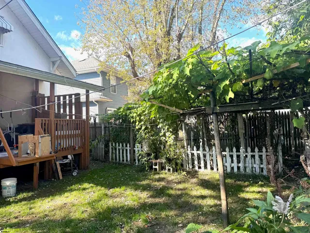 a view of backyard with trampoline