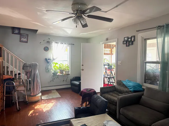 a living room with furniture and a window