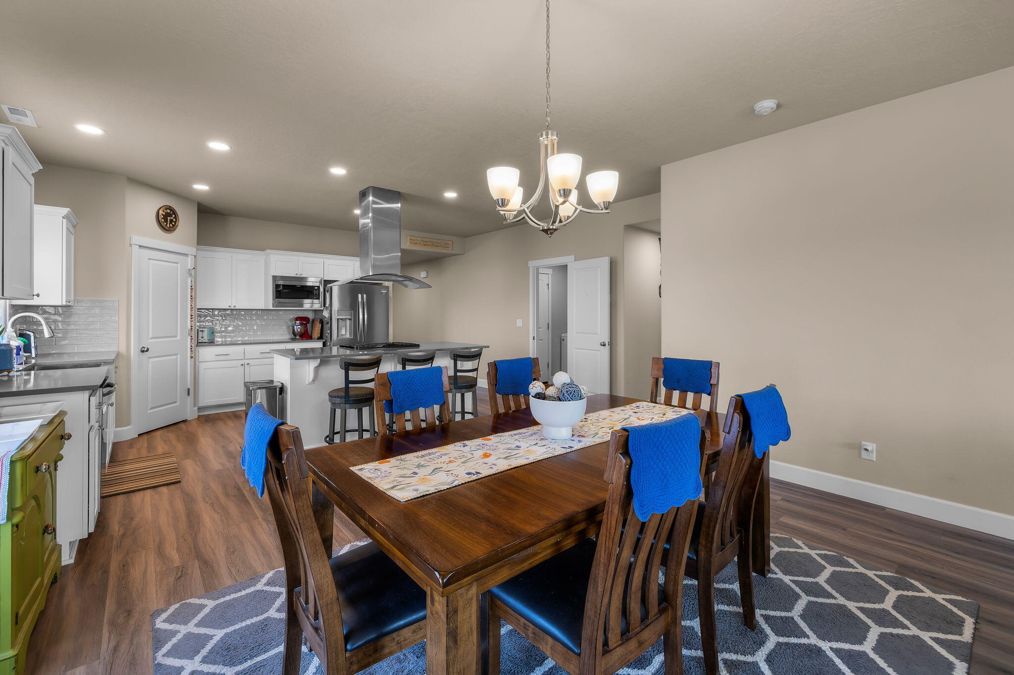 1132 Northwest Golf Course Drive Madras, OR 97741 - Photo 8 of 36 a view of a dining room with furniture and wooden floor