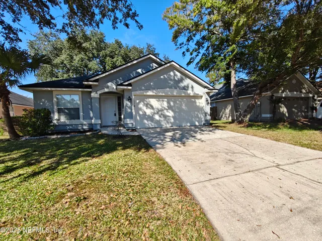 a kitchen with stainless steel appliances a refrigerator sink and microwave