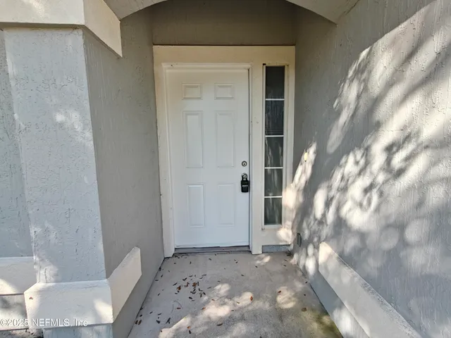 a kitchen with a refrigerator sink and cabinets