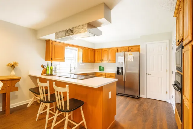a kitchen with a table and chairs