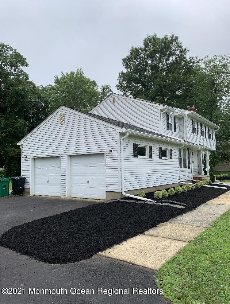 8 Tudor Road Freehold, NJ 07728 - Photo 2 of 46 a front view of a house with a garden
