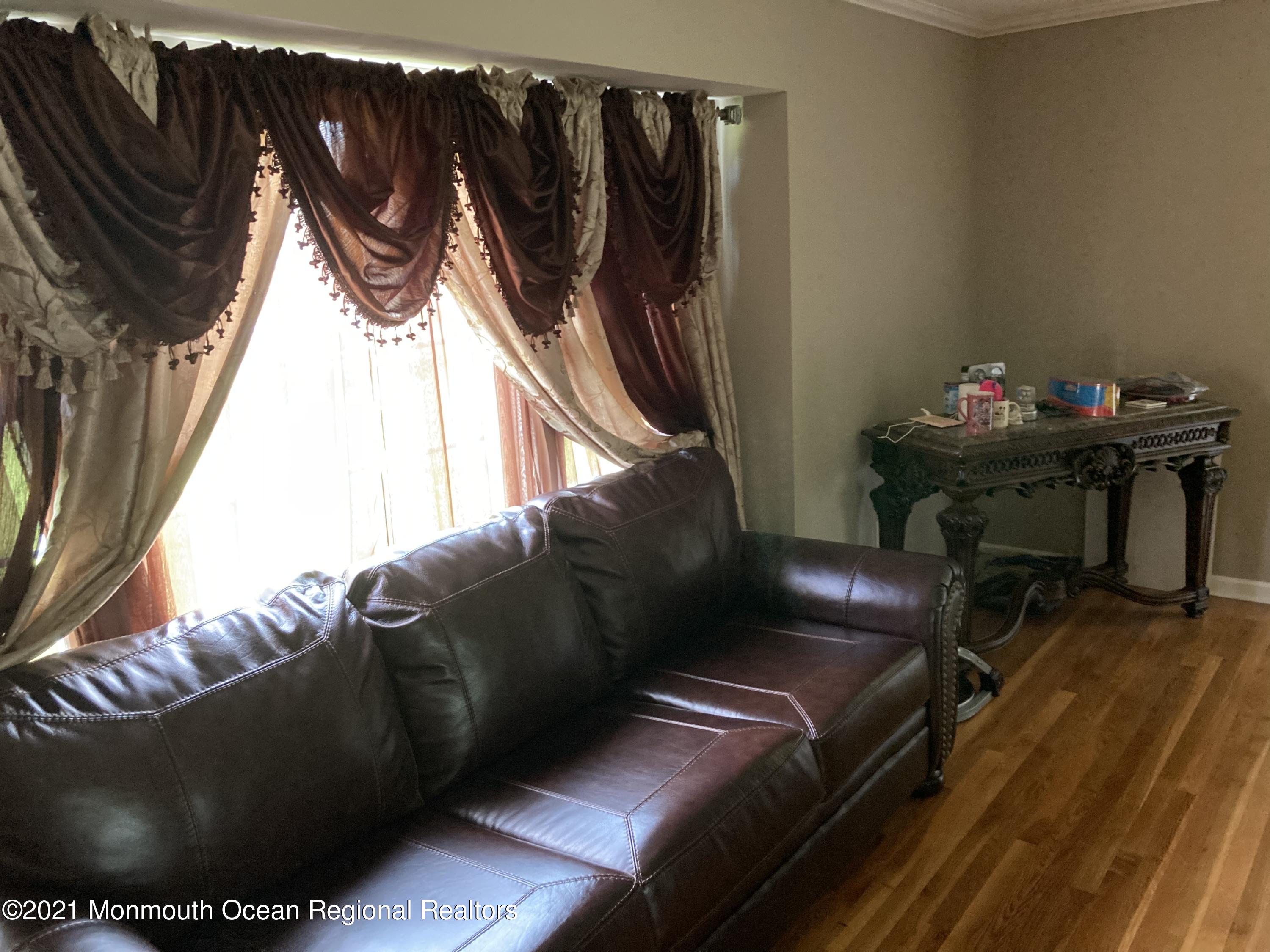 8 Tudor Road Freehold, NJ 07728 - Photo 17 of 46 a living room with furniture