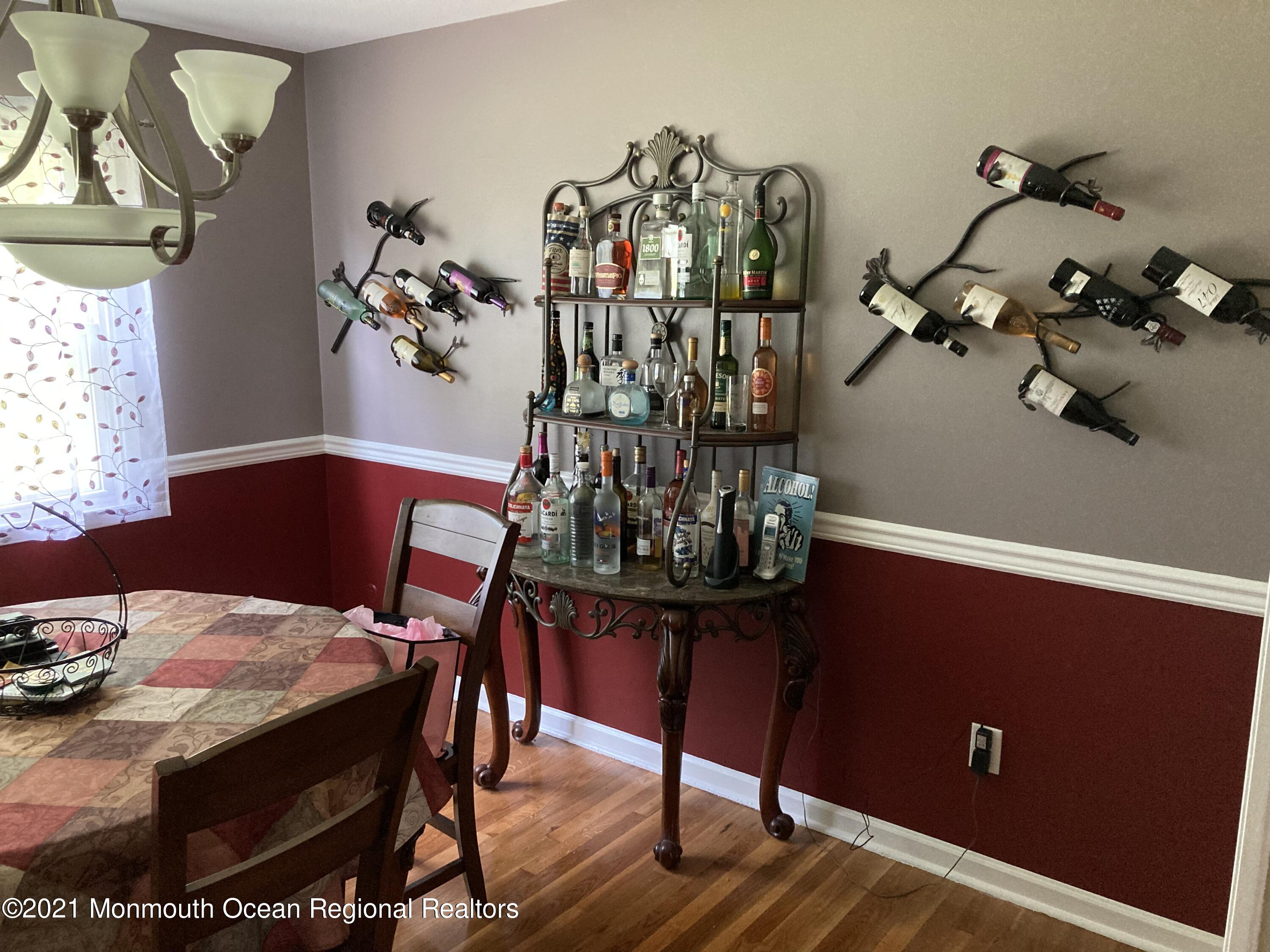 8 Tudor Road Freehold, NJ 07728 - Photo 20 of 46 a view of a dining room with furniture and wooden floor