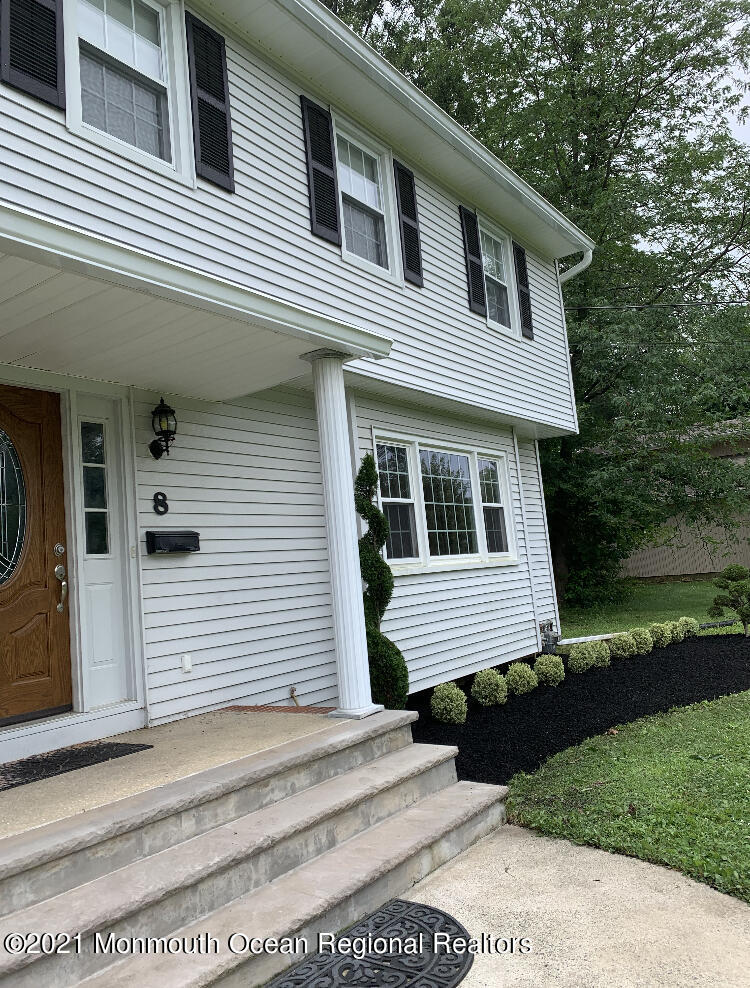 8 Tudor Road Freehold, NJ 07728 - Photo 3 of 46 a front view of a house with a yard
