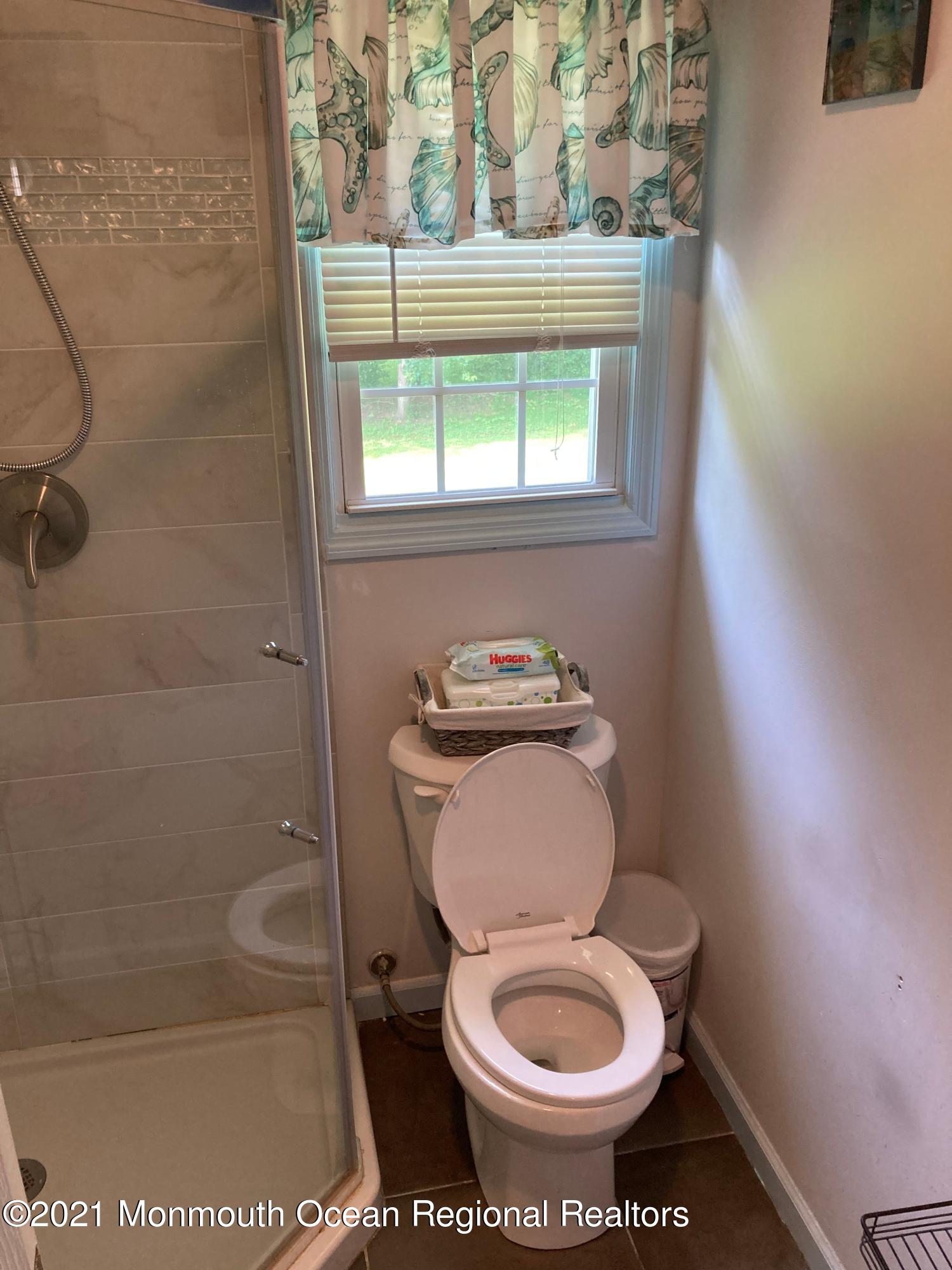 8 Tudor Road Freehold, NJ 07728 - Photo 28 of 46 a bathroom with a toilet and a shower