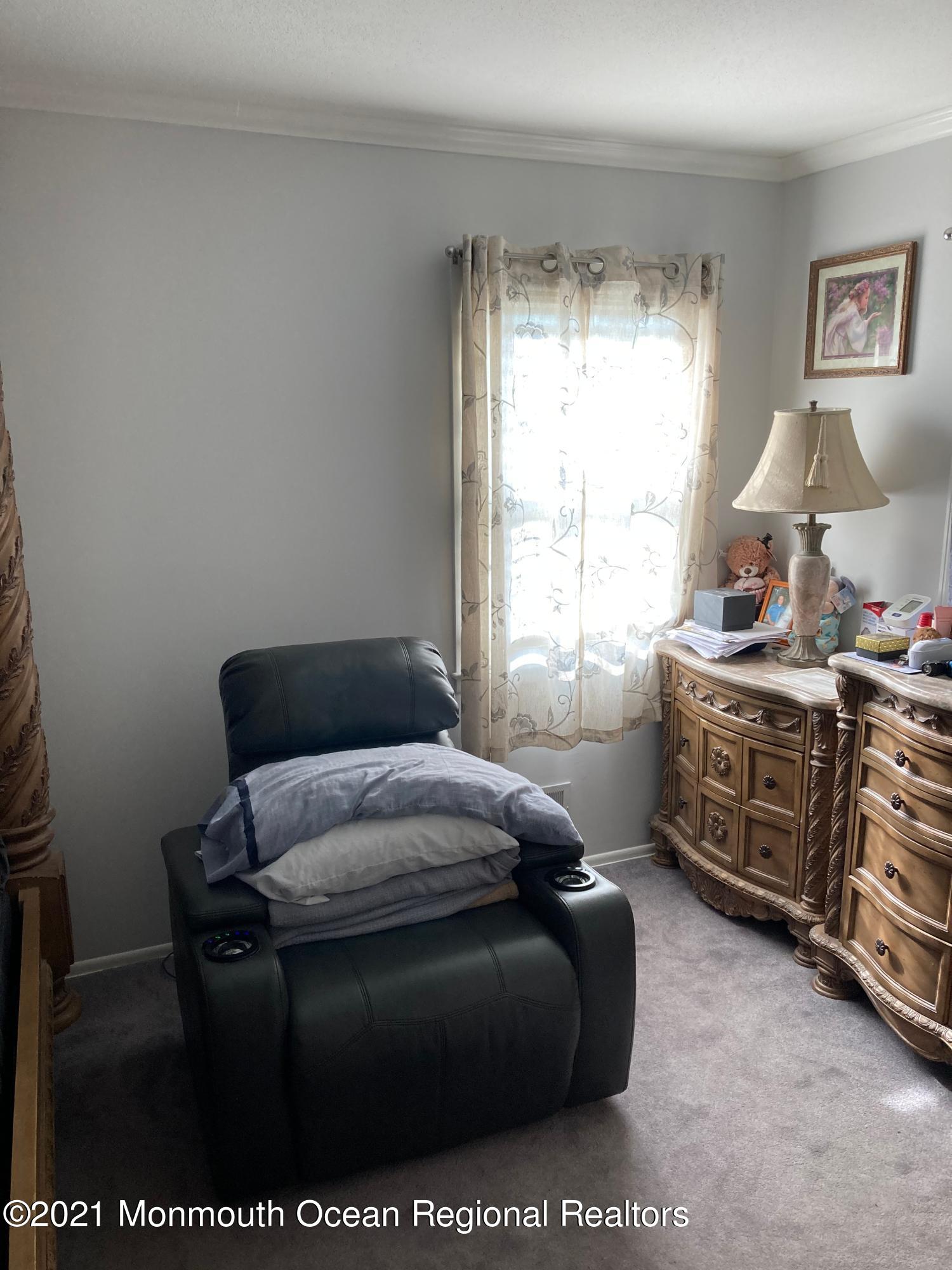 8 Tudor Road Freehold, NJ 07728 - Photo 34 of 46 a bedroom with furniture and a window