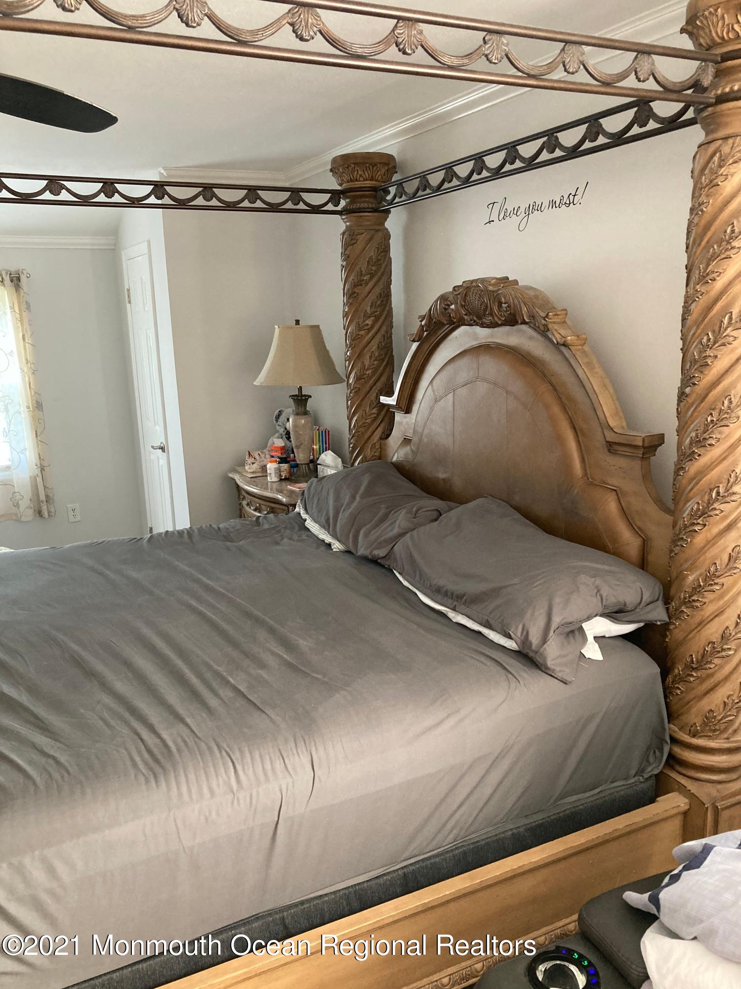 8 Tudor Road Freehold, NJ 07728 - Photo 36 of 46 a bed with white sheets and pillows on it