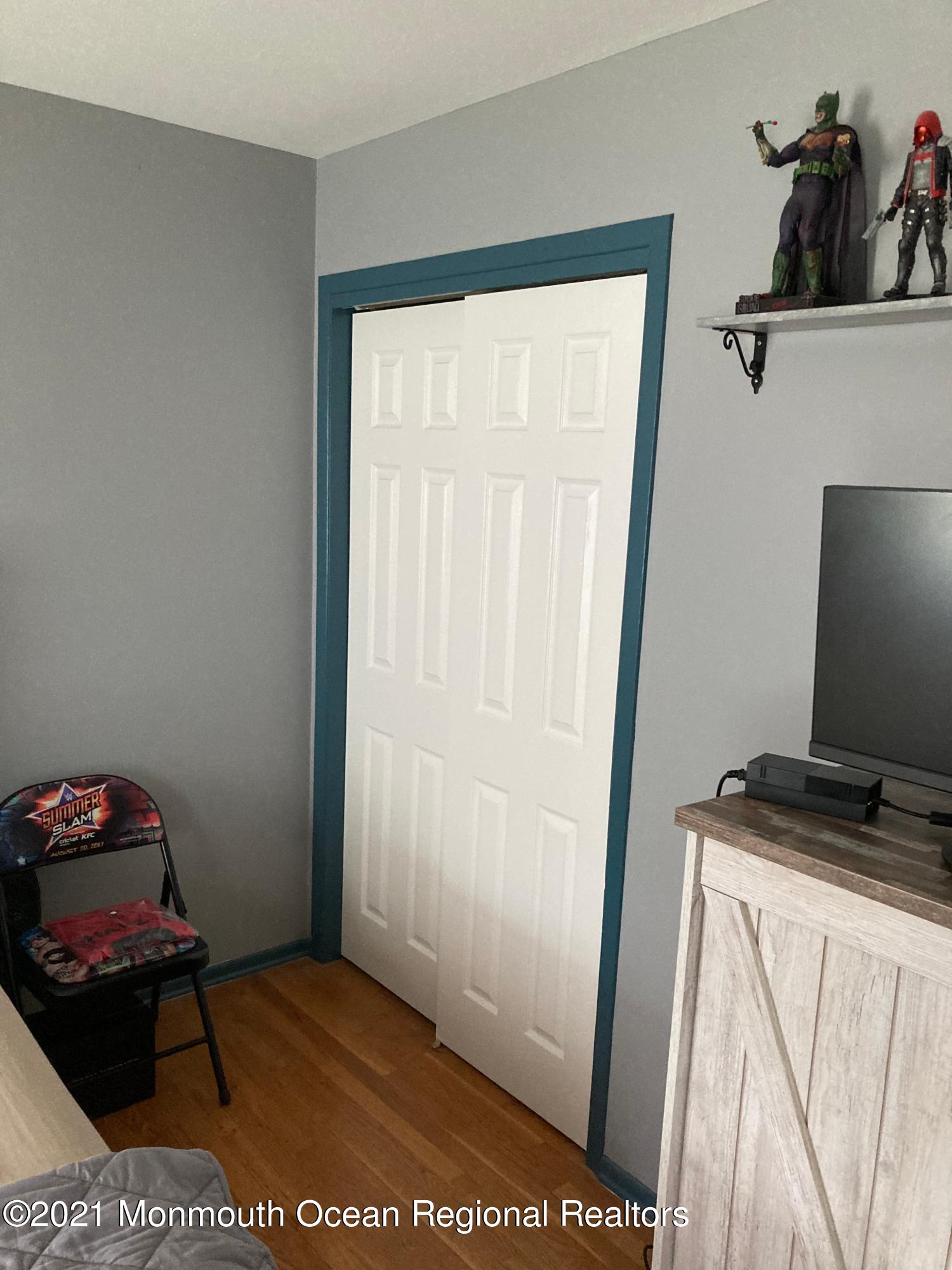 8 Tudor Road Freehold, NJ 07728 - Photo 41 of 46 a bedroom with a bed and a window