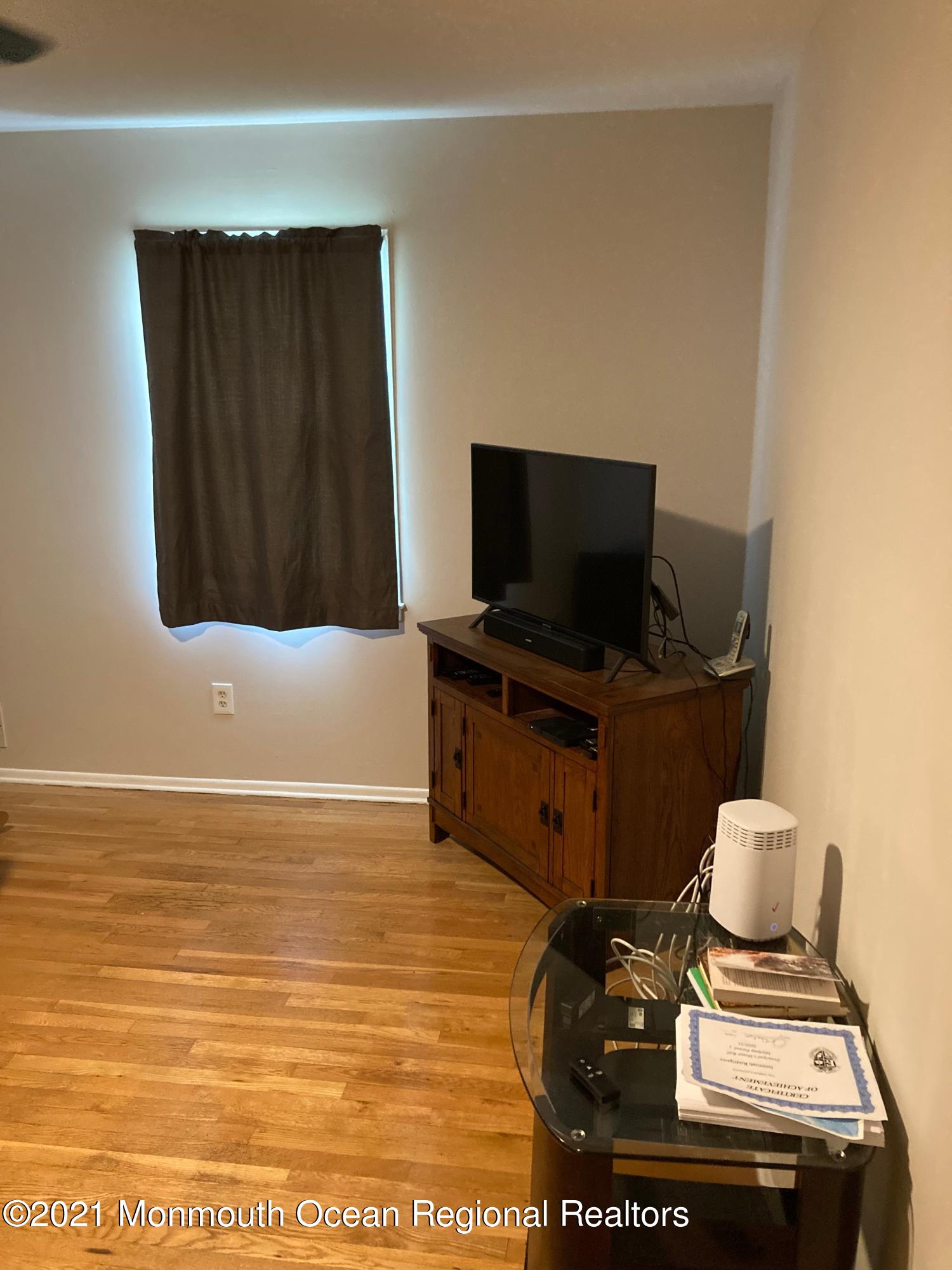 8 Tudor Road Freehold, NJ 07728 - Photo 45 of 46 a view of workspace with wooden floor