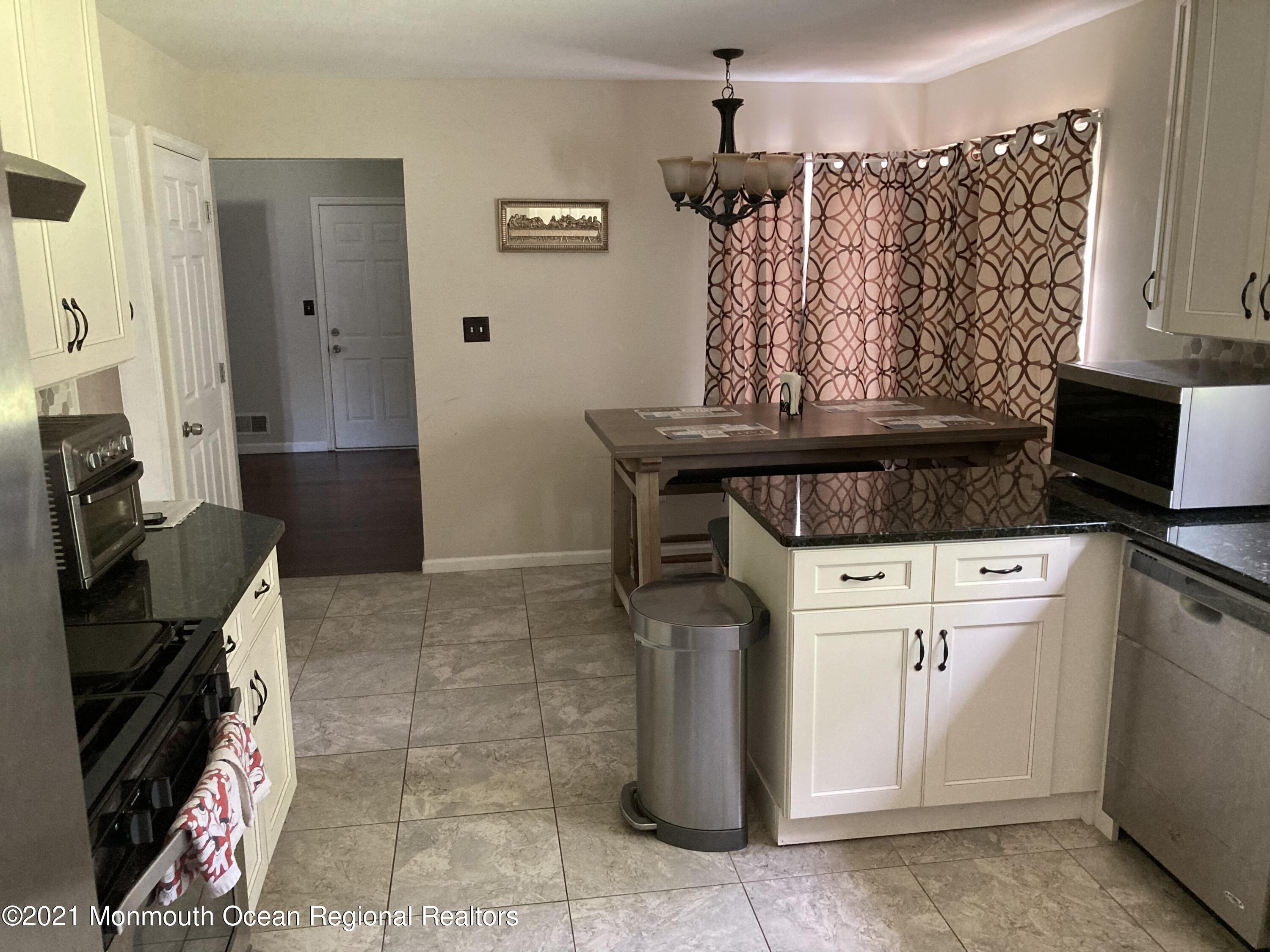 8 Tudor Road Freehold, NJ 07728 - Photo 9 of 46 a view of a storage and utility room