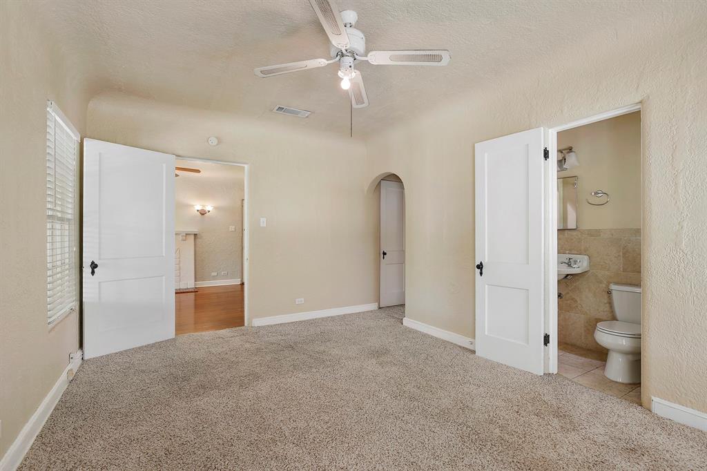 6025 Lewis Street Dallas, TX 75206 - Photo 16 of 37 a view of a bathroom with a shower and a toilet
