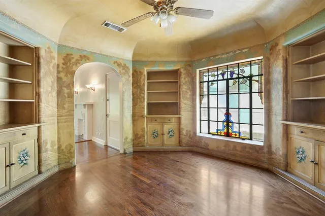 a kitchen with stainless steel appliances a sink and a refrigerator