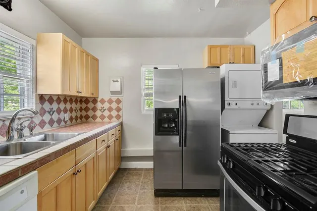 a kitchen with a stove and a microwave