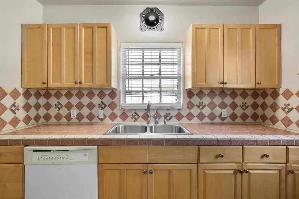 6025 Lewis Street Dallas, TX 75206 - Photo 24 of 37 a view of a kitchen with granite countertop cabinets