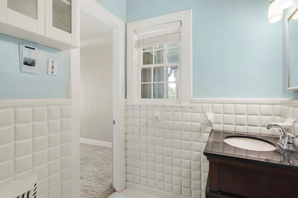 6025 Lewis Street Dallas, TX 75206 - Photo 31 of 37 a bathroom with a sink and a shower