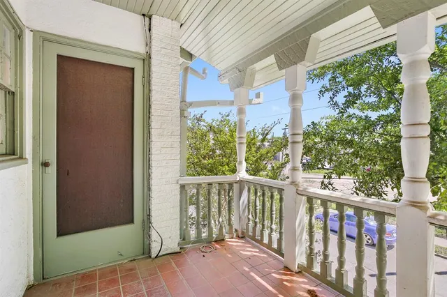 a view of a porch with wooden floor and outdoor space