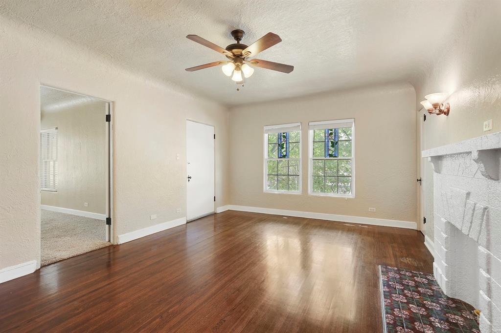 6025 Lewis Street Dallas, TX 75206 - Photo 7 of 37 a view of an empty room with wooden floor and a window