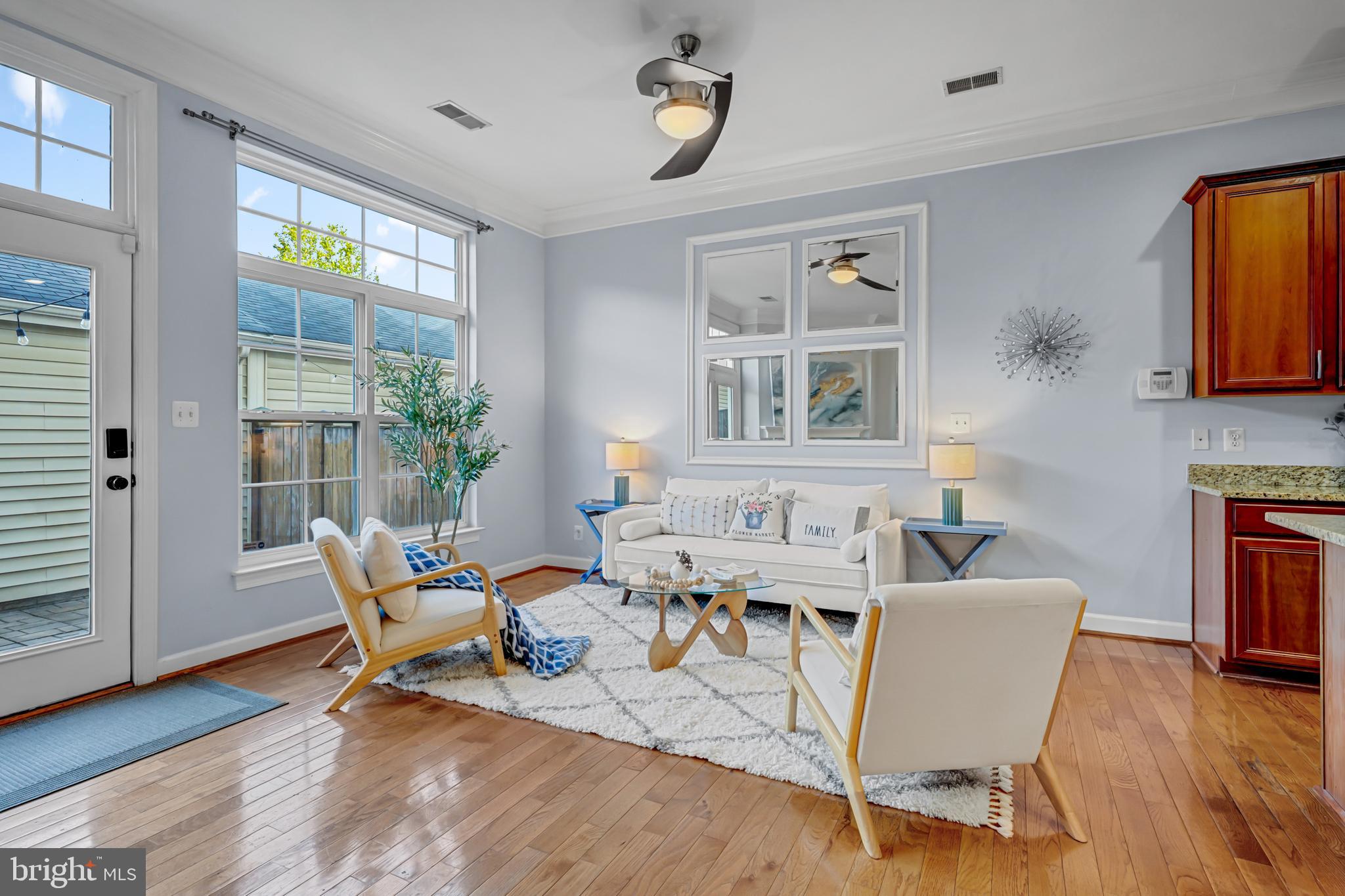 9231 Ribbon Falls Loop Bristow, VA 20136 - Photo 7 of 40 a view of a dining room with furniture window and wooden floor
