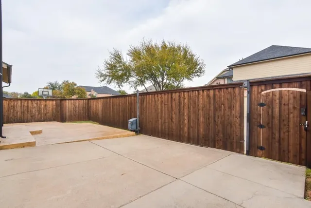 a view of outdoor space with wooden fence