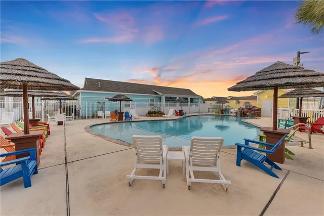 swimming pool view with a outdoor seating space
