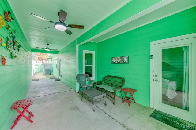 a front view of house with yard and trees around