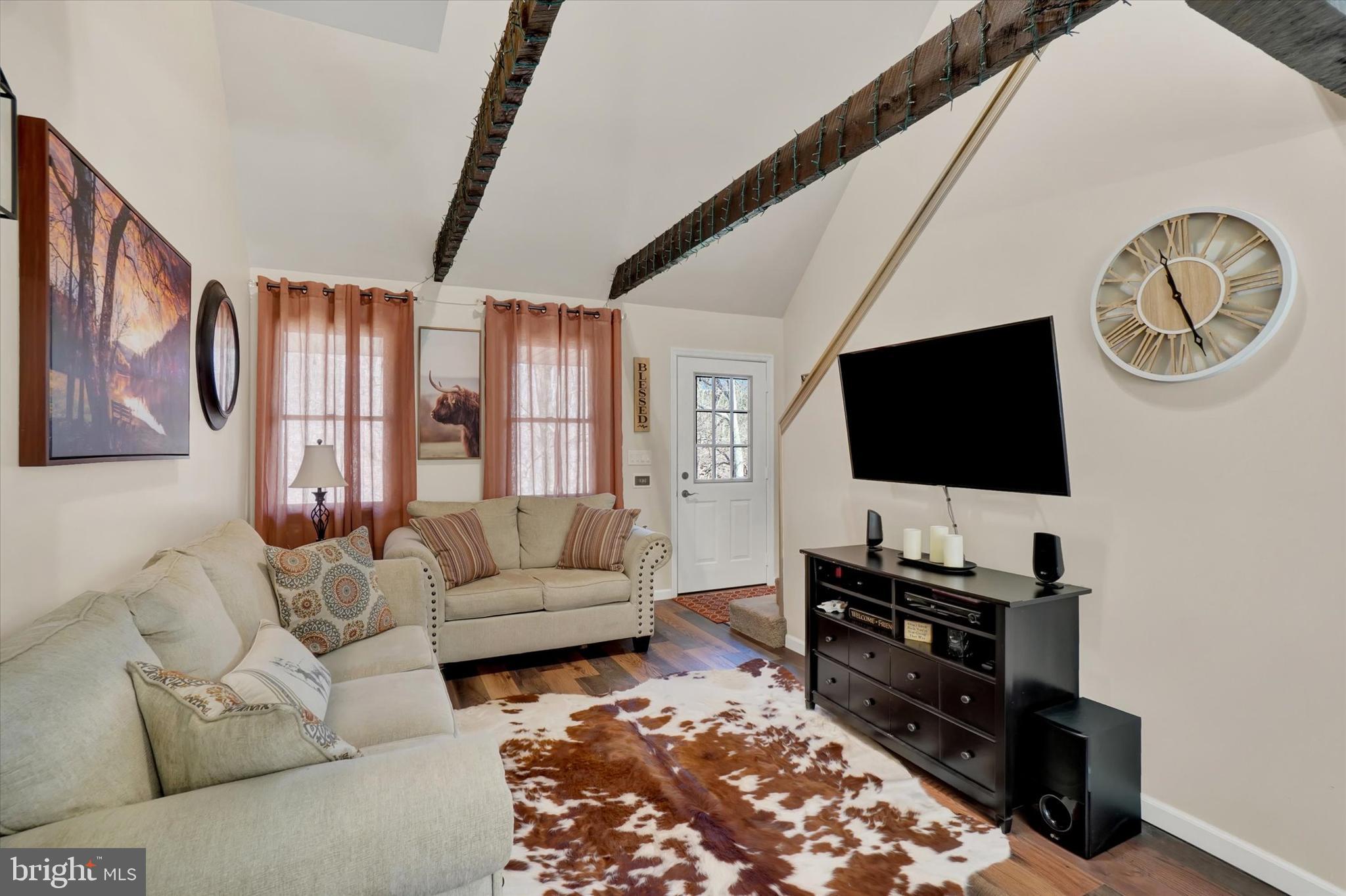 82 Fox Creek Road Wrightsville, PA 17368 - Photo 13 of 32 a living room with furniture and a flat screen tv