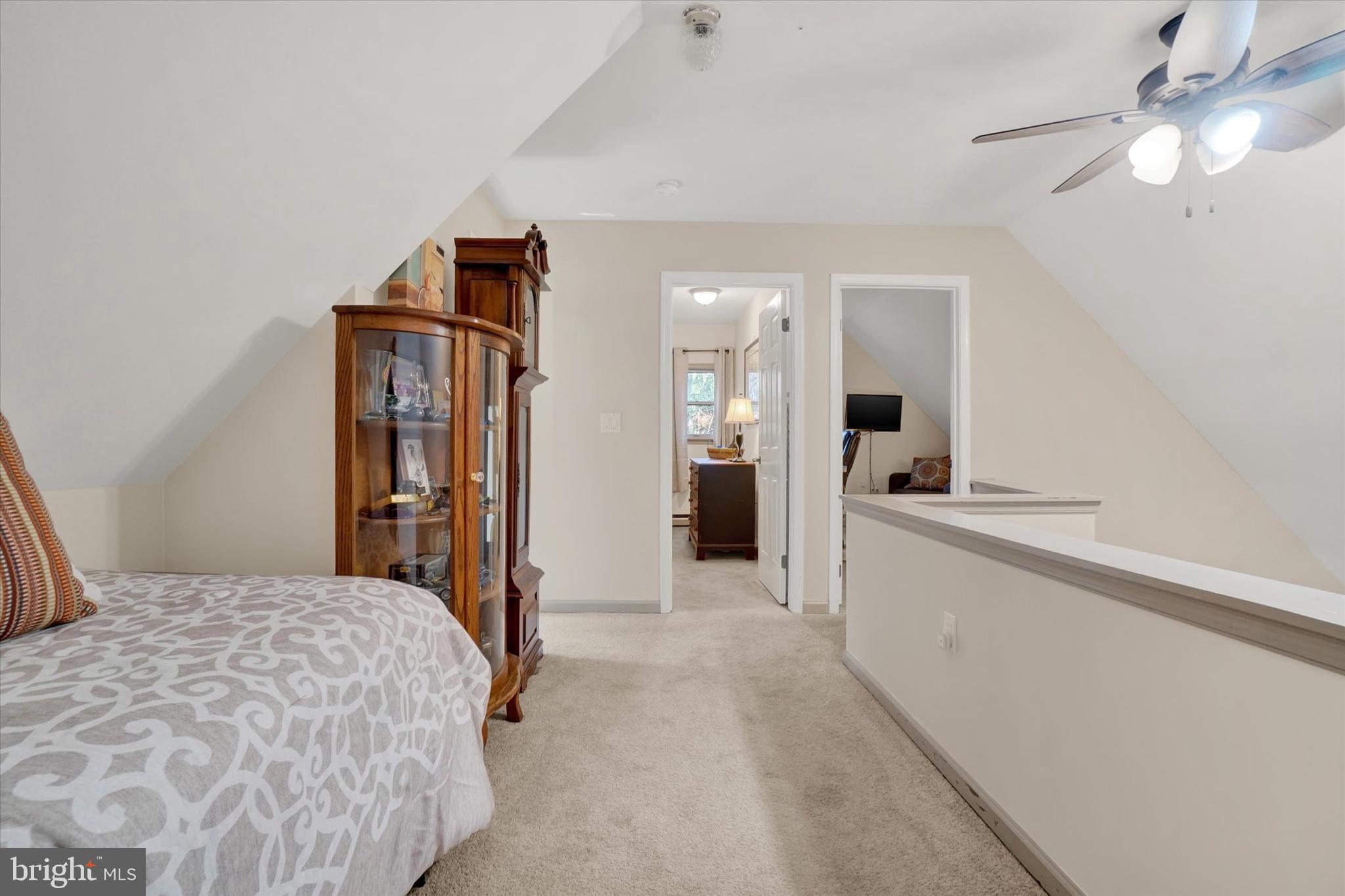 82 Fox Creek Road Wrightsville, PA 17368 - Photo 18 of 32 a bedroom with a large bed and a chandelier