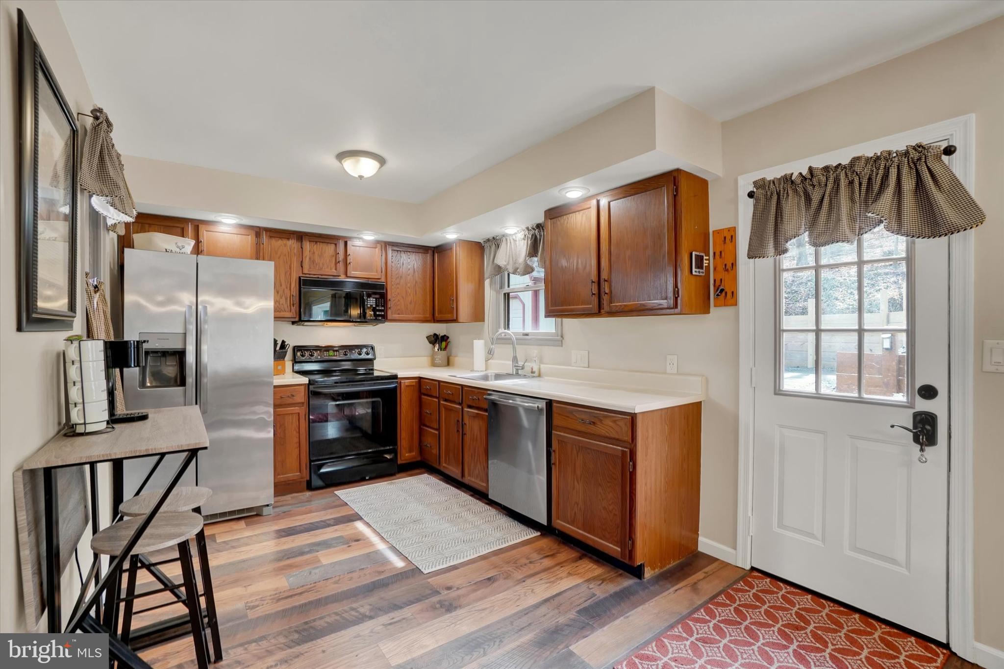 82 Fox Creek Road Wrightsville, PA 17368 - Photo 4 of 32 a kitchen with stainless steel appliances granite countertop a refrigerator a stove top oven a sink and dishwasher