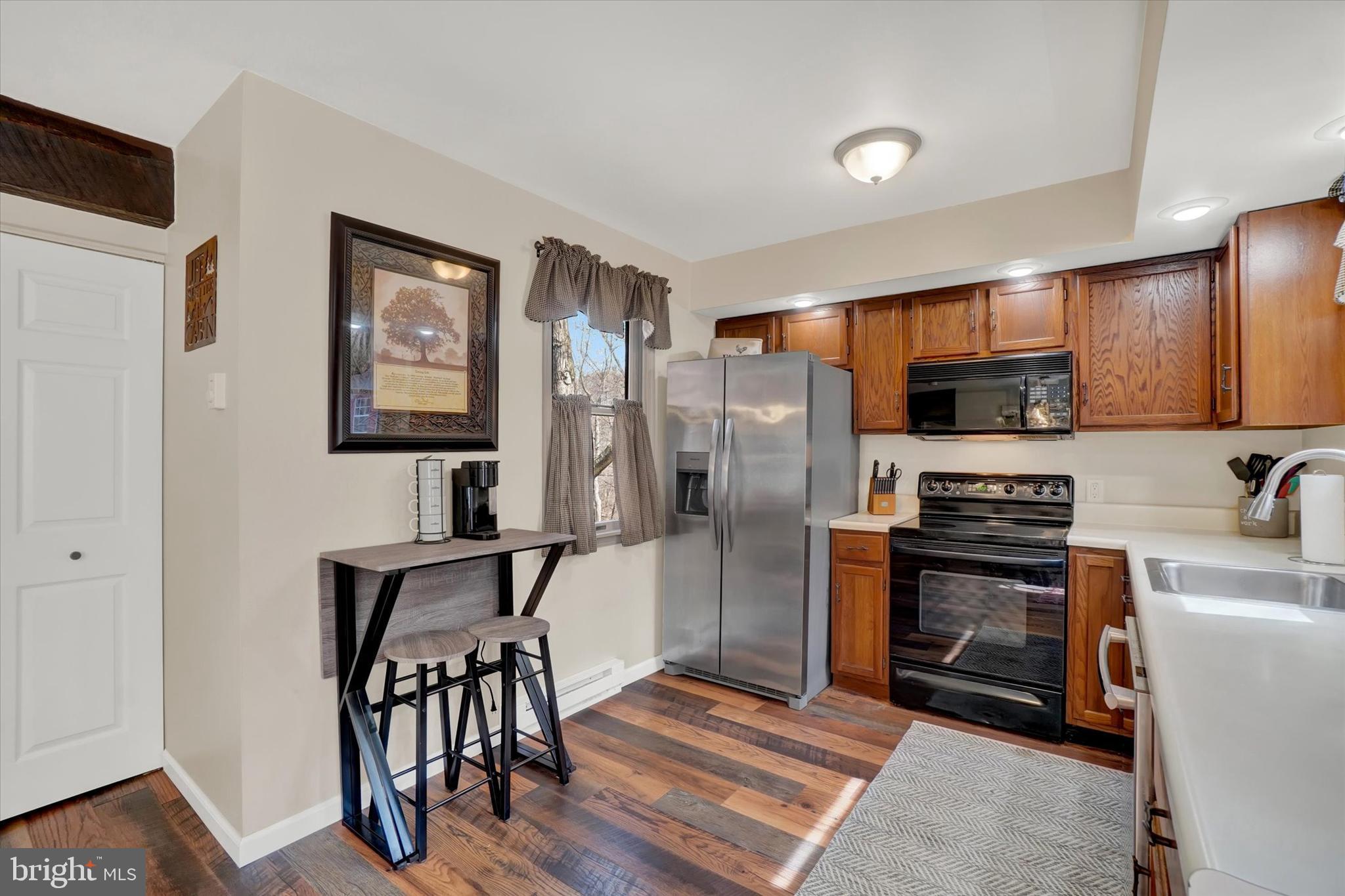 82 Fox Creek Road Wrightsville, PA 17368 - Photo 5 of 32 a kitchen with stainless steel appliances a refrigerator stove microwave and sink