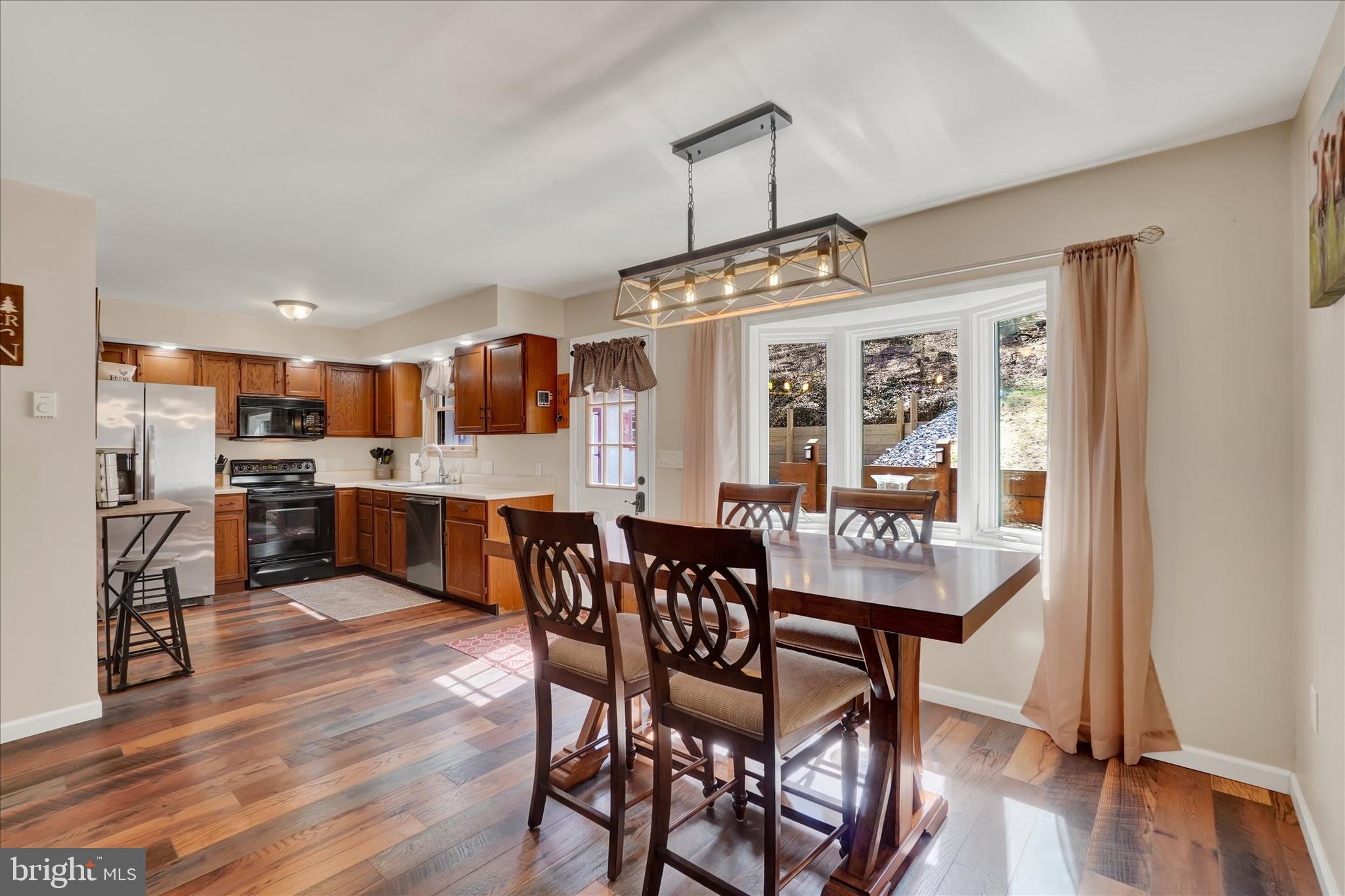 82 Fox Creek Road Wrightsville, PA 17368 - Photo 8 of 32 a view of a dining room with furniture window and wooden floor