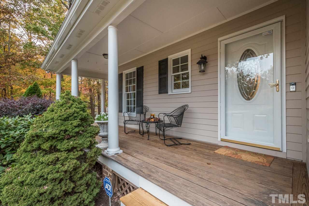 12217 Norwood Road Raleigh, NC 27613 - Photo 3 of 27 a house view with a seating space