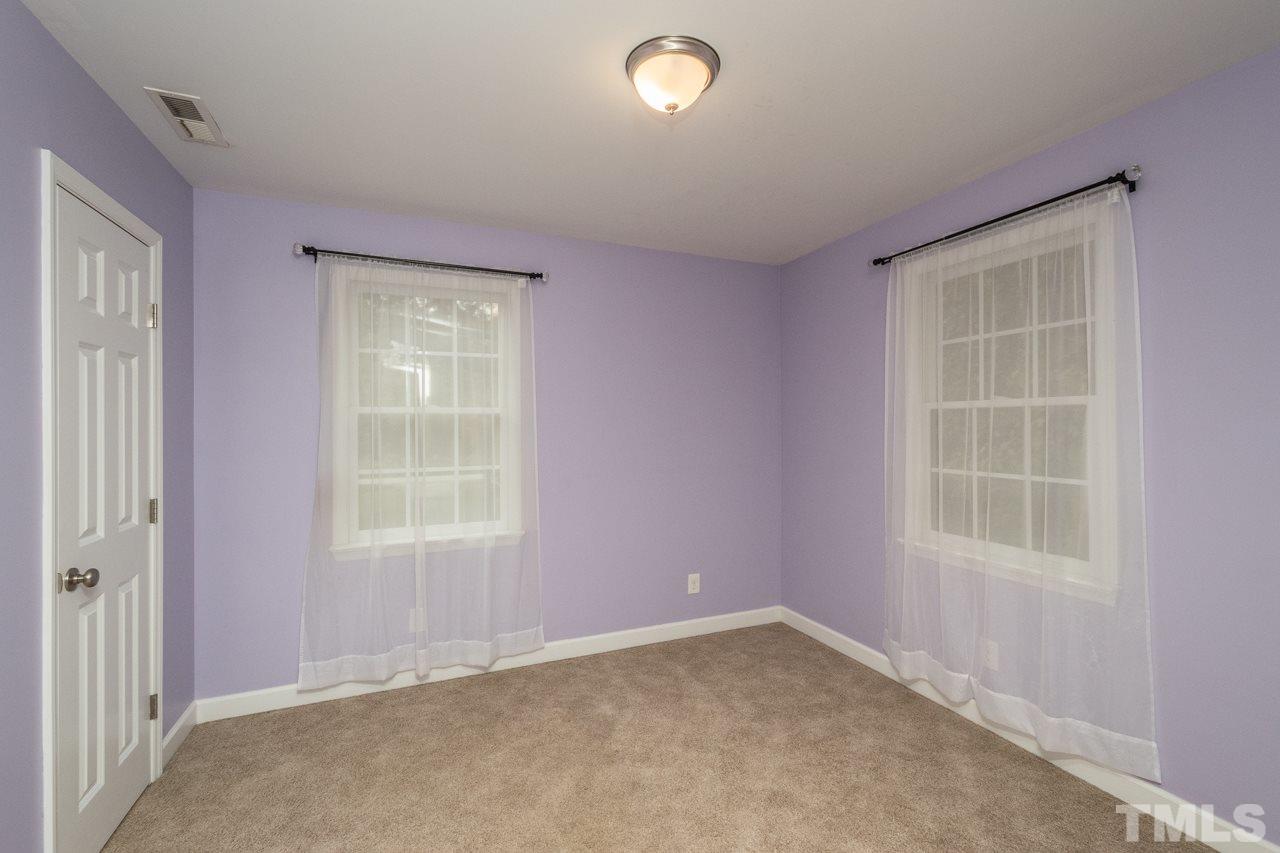 12217 Norwood Road Raleigh, NC 27613 - Photo 26 of 27 an empty room with a window